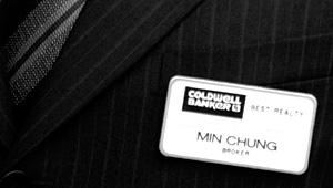 A name tag of Coldwell Banker Best Realty agent